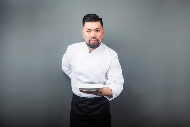 An Asian male chef