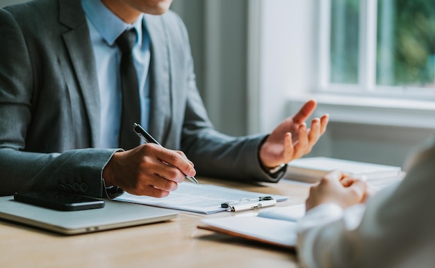 Asian male director is interviewing to recruit new employees