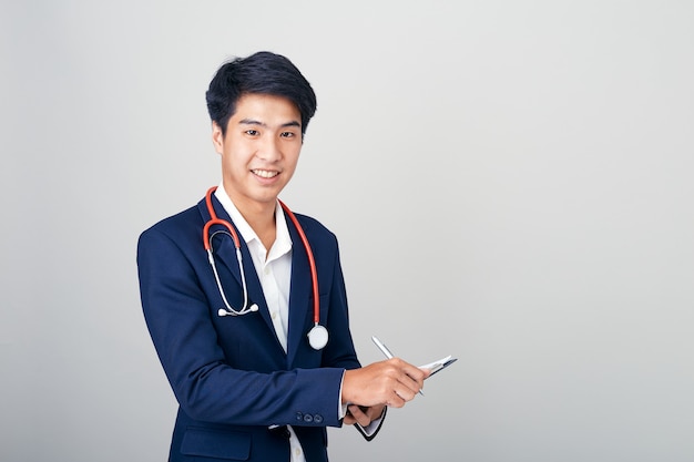 Asian male nutritionist with clipboard