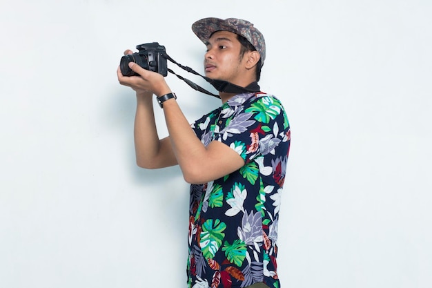 Asian male professional photographer  wearing summer shirt isolated on white background