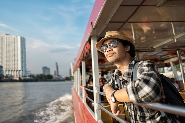 Asian man bag pack tourist in travelling at Thailand.