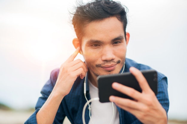 Asian man call phone happy online communication