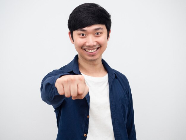 Asian man cheerful show fist to you with happy smile portrait