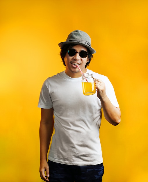 Asian Man Drinking Orange Juice Wearing Sunglasses and Fedora Hat