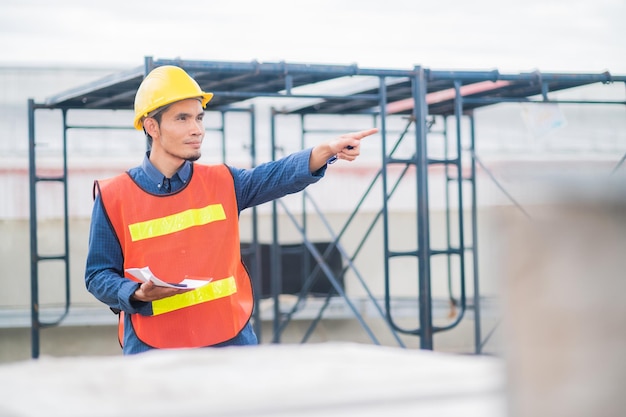 Asian man engineer are working in factory and checking safety system control on production industrial