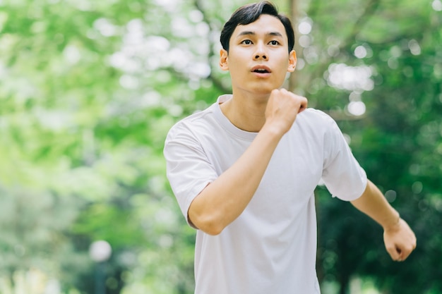 Asian man exercising in park