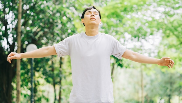 Asian man exercising in park