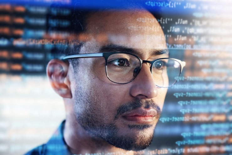 Photo asian man face and programming at night with overlay or dashboard of code malware or software at office male person coder or programmer working late in development problem solving or algorithm