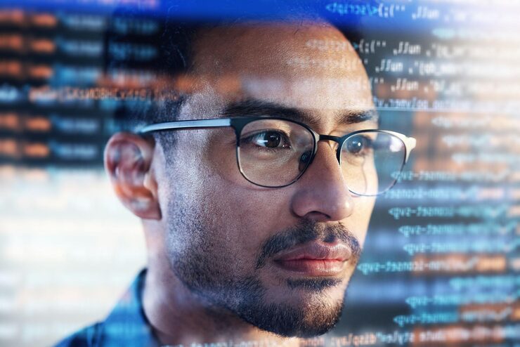 Photo asian man face and programming at night with overlay or dashboard of code malware or software at office male person coder or programmer working late in development problem solving or algorithm