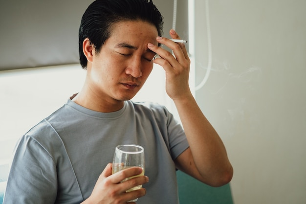 Asian man feels desperate for smoking addiction