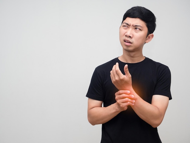 Asian man feels pain his wrist isolated