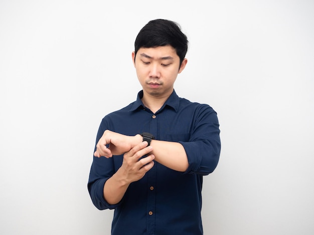 Asian man gesture looking at his watch serious emotion white background