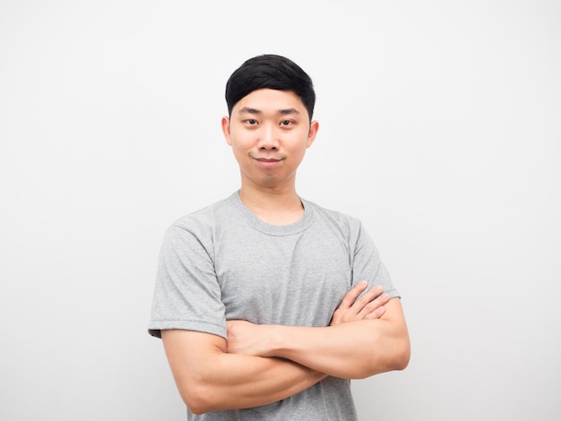 Photo asian man grey shirt corss arms look confident white background