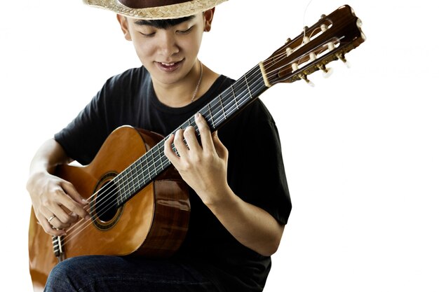 Asian man playing classic guitar isolated on white 