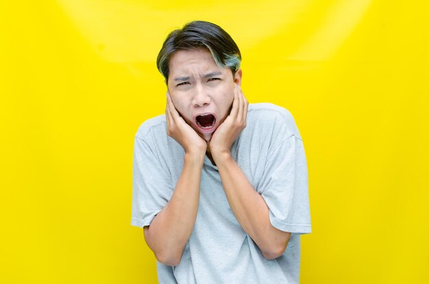 Asian man shouting and pointing his finger in anger