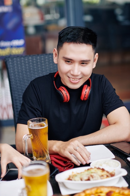 Asian man sitting in cafe