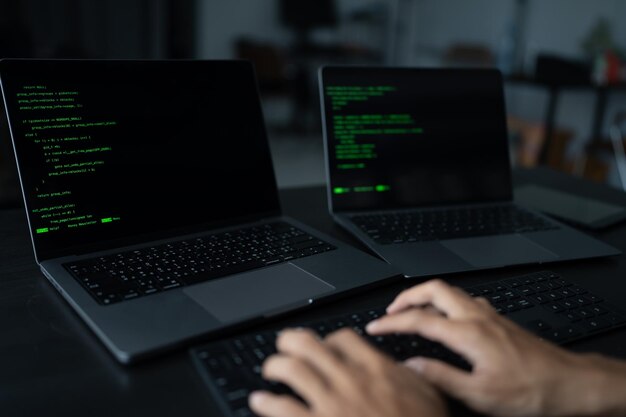 asian man software engineer working on computer at office desk for writing program code it software engineer finding errors tech support devops creating digital