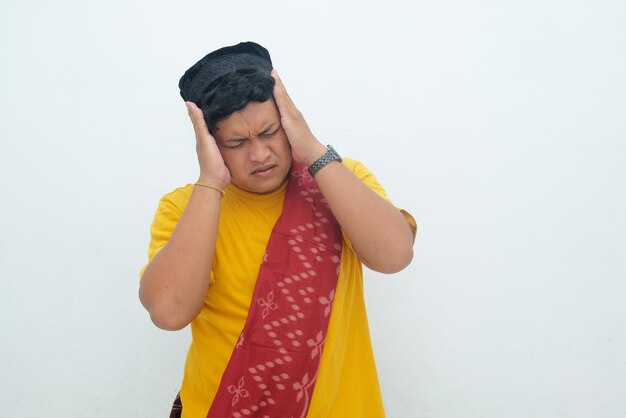 Photo asian man touching his head stresses or frustrated isolated in white background