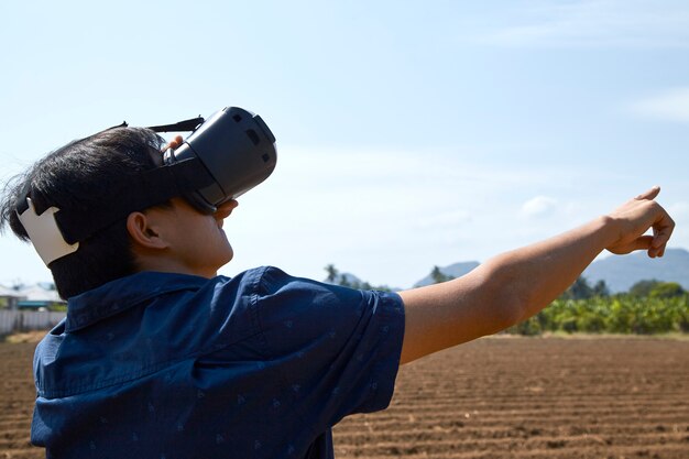 Asian man using the virtual reality headset