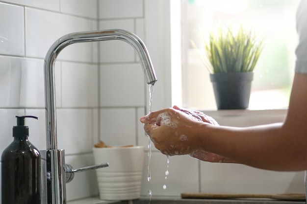 Asian Man Washing Hand with Soap 