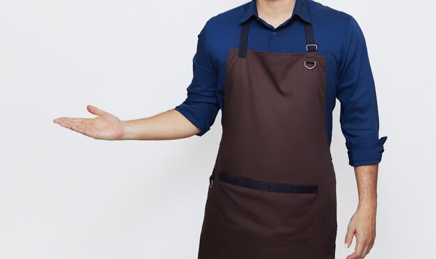 Photo asian man wearing apron with one hand showing something no face isolated white background