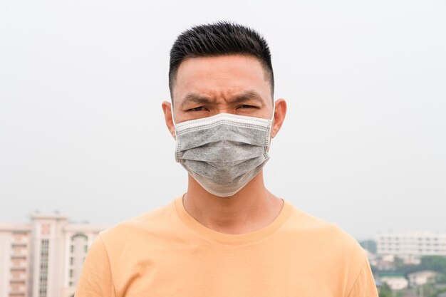 Asian man wearing facial hygienic mask