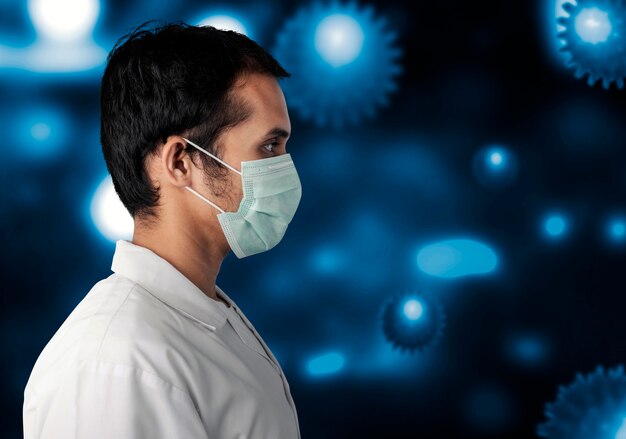 コロナウイルスの拡散を阻止するためにインフルエンザのマスクを身に着けているアジア人男性