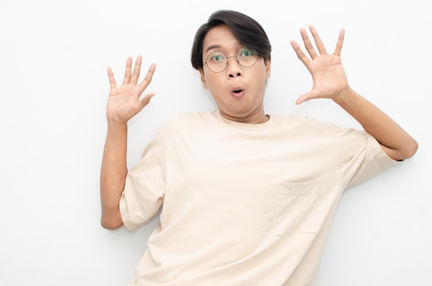 asian man with glasses feels shock with wow surprised expression.