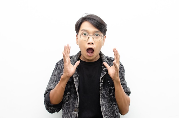 Asian man with glasses oprning mouth expressing shock and surprise with a wow look