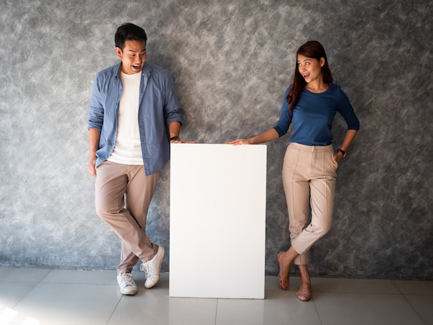 Asian Man and woman with white banner copy space