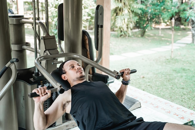 Asian man working out at the gym