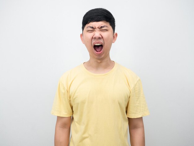 Asian man yellow shirt gesture shout portrait