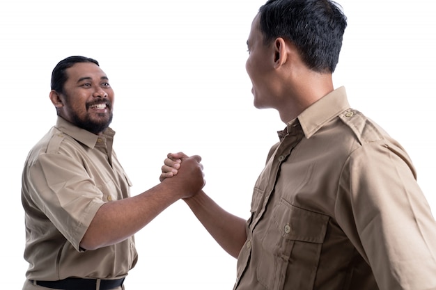 Asian men in uniform marking a partnership