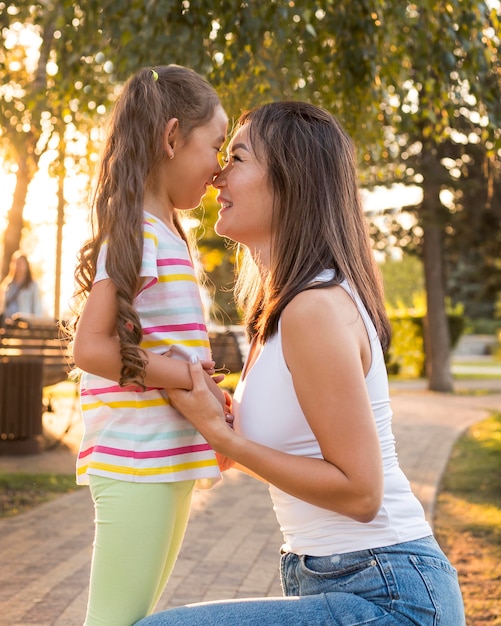 Asian mother and daughter being close