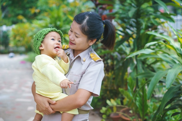 Asian Mother holding her baby