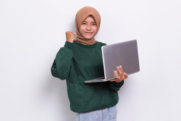 asian muslim hijab woman using her laptop computer isolated on white background