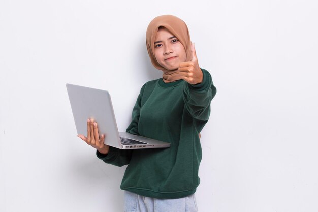 asian muslim hijab woman using her laptop computer isolated on white background