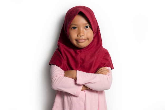 Asian Muslim little girl on a white background