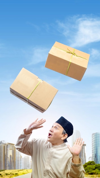 Asian Muslim man afraid of dropping box