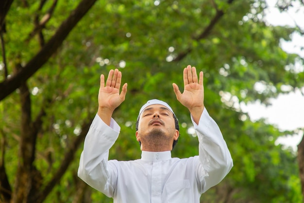 Asian muslim praying To Allah God Of Islam.