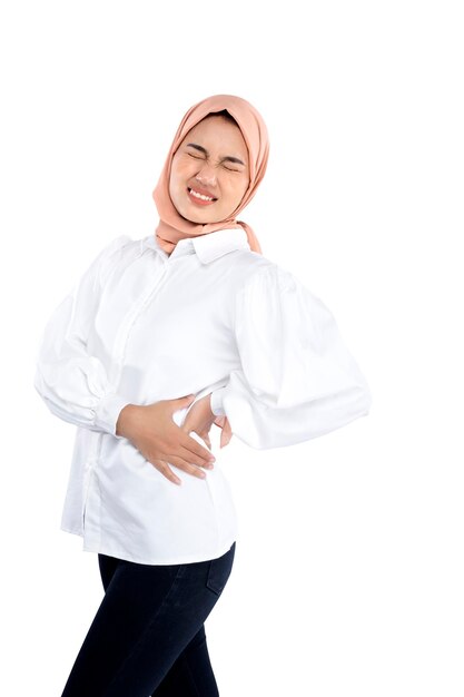 Asian Muslim woman in a head scarf feeling back pain