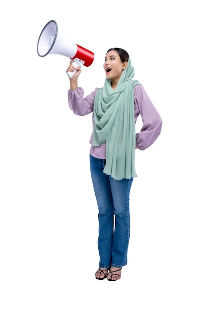 Asian Muslim woman in a headscarf yelling on a megaphone