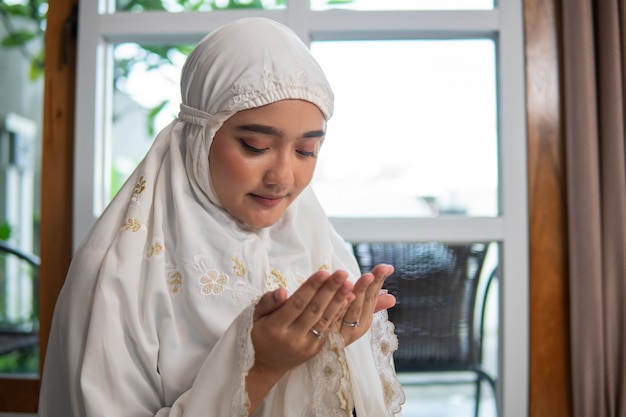 Asian muslim woman praying