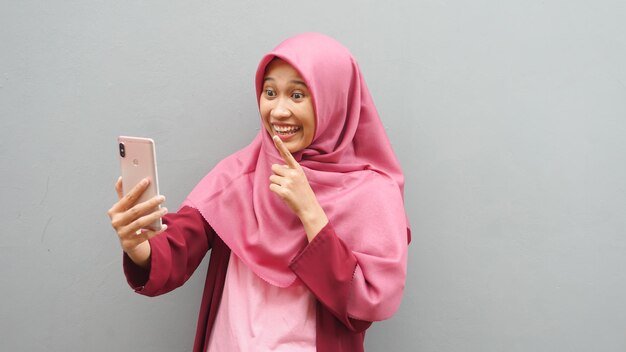 Asian muslim woman video call gesture