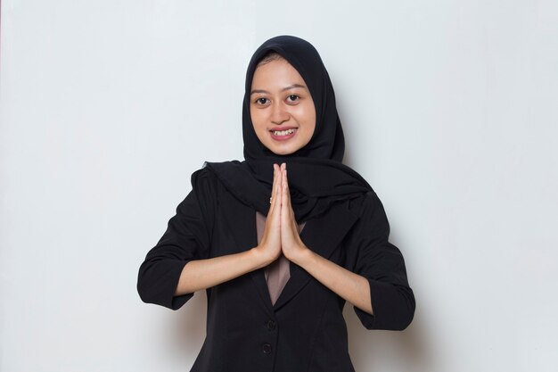 Asian muslim woman welcoming guests