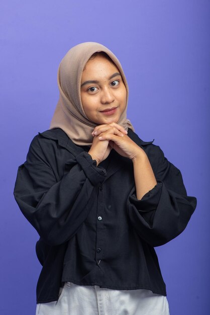 Asian Muslim Woman with Attractive Gesture on Purple Background