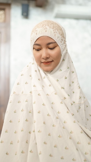 Asian Muslim women perform the obligatory prayers in the mosque