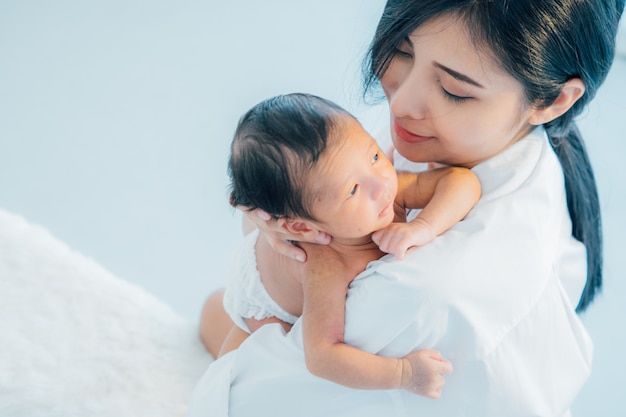 Asian newborn baby with mother 