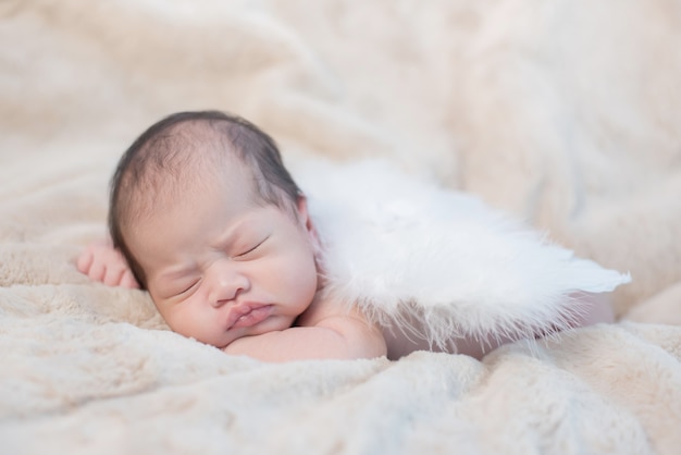 Asian newborn. Lovely kid and little child of parent.