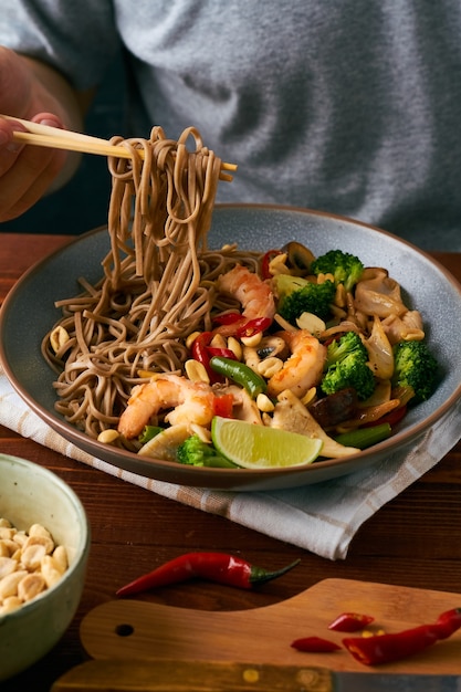 Asian noodles with shrimps squid vegetables